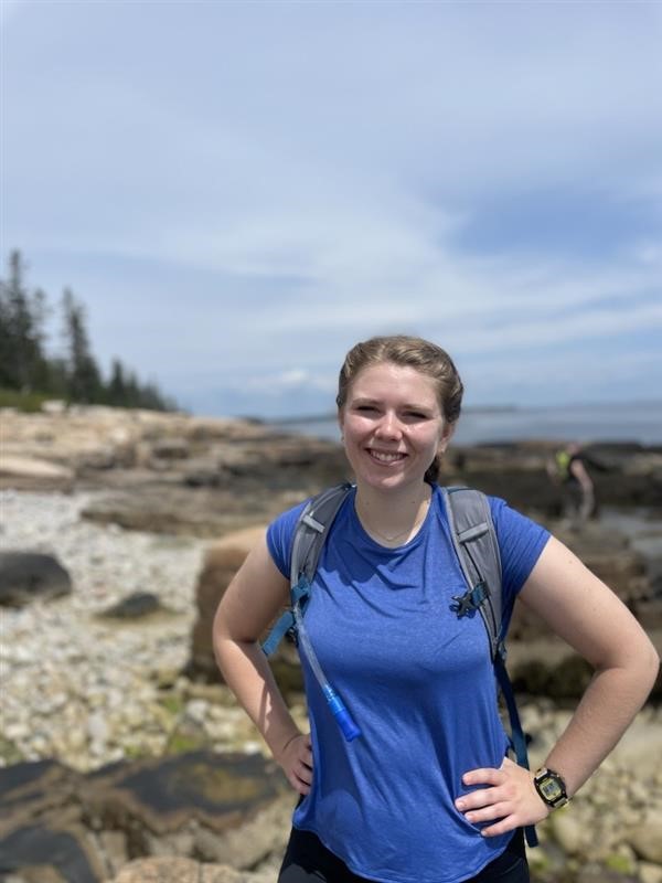 Sarah Ross '25 is shown stopping for a photo while hiking.
